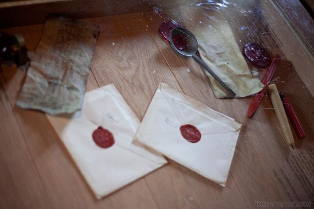 Sealed envelopes next to documents and wax sealing tools - Muiden, Netherlands