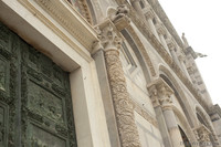 Detail of an engaged column of the central portal of the Pisa Cathedral - Pisa, Italy