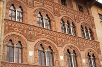 Detail of the façade of Palazzo Agostini - Pisa, Italy