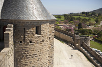 Detail of a round tower and its scaly-looking cupola - Carcassonne, France