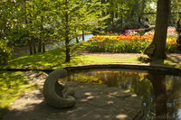 Pond, flower bed of tulips and canal near the Queen Juliana pavilion - Lisse, Netherlands